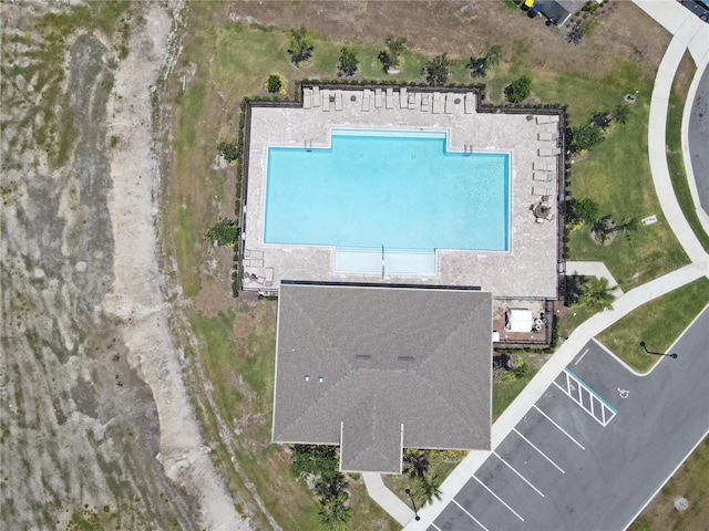 view of subject property featuring a pool area