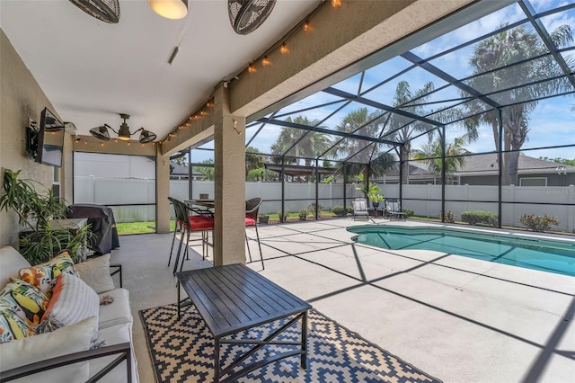 view of pool featuring outdoor lounge area, a fenced backyard, a patio area, and a lanai