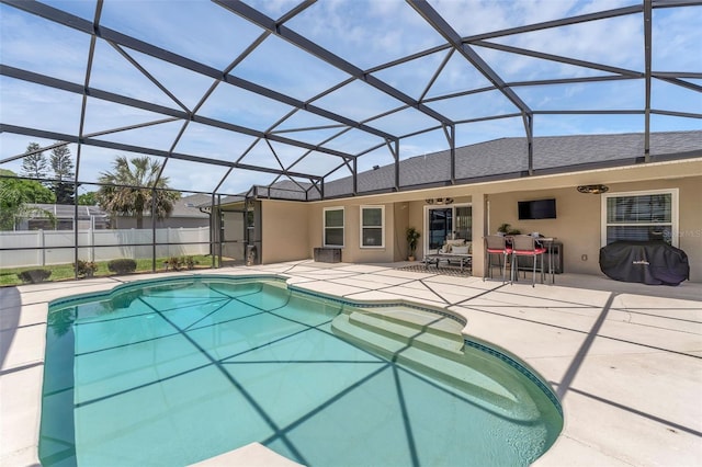 view of pool with a patio and a lanai
