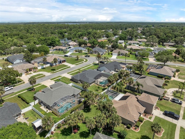 aerial perspective of suburban area with a heavily wooded area