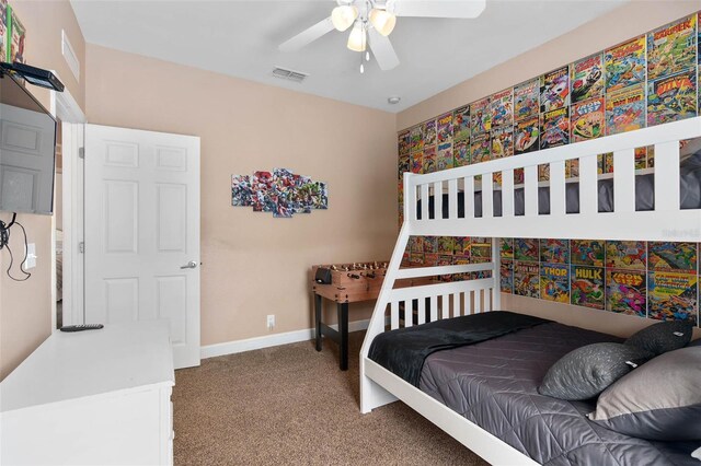 2952 Lucayan Harbour Cir Unit 105, Kissimmee, FL 34746 - bedroom with carpet, baseboards, and a ceiling fan