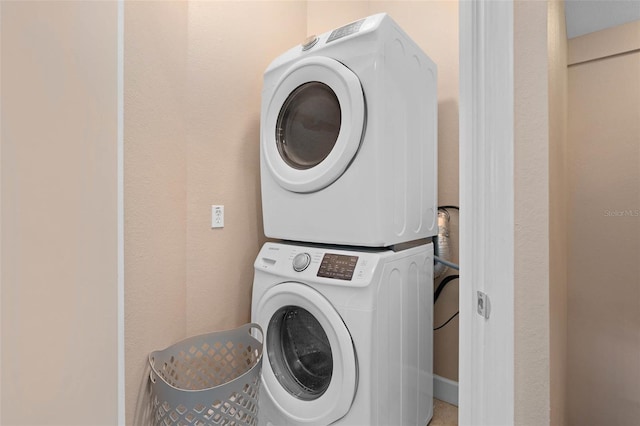 2952 Lucayan Harbour Cir Unit 105, Kissimmee, FL 34746 - laundry area with stacked washing machine and dryer