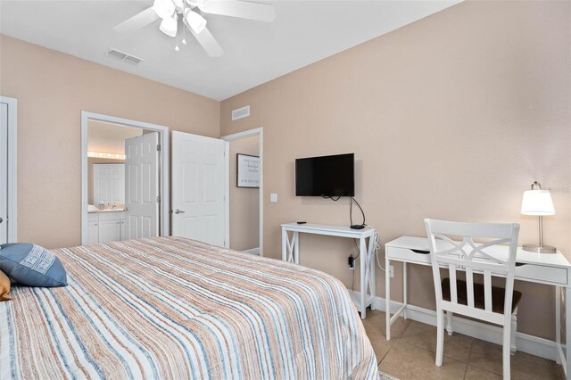 2952 Lucayan Harbour Cir Unit 105, Kissimmee, FL 34746 - bedroom with light tile patterned flooring, baseboards, and a ceiling fan