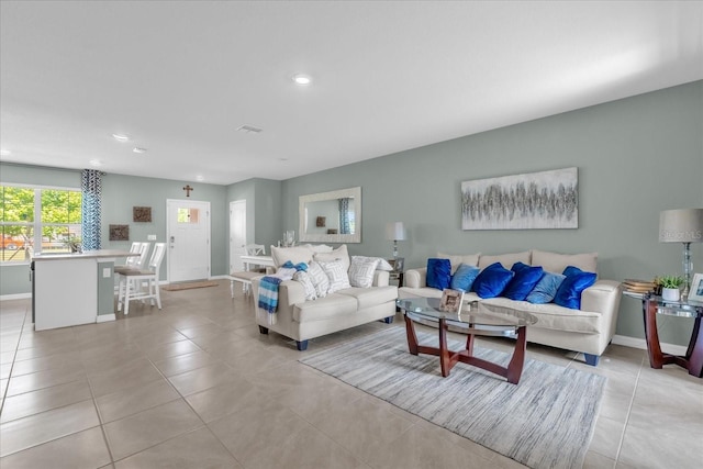 1555 Dawnview Way, Kissimmee, FL 34744 - living room featuring light tile patterned floors, recessed lighting, and baseboards