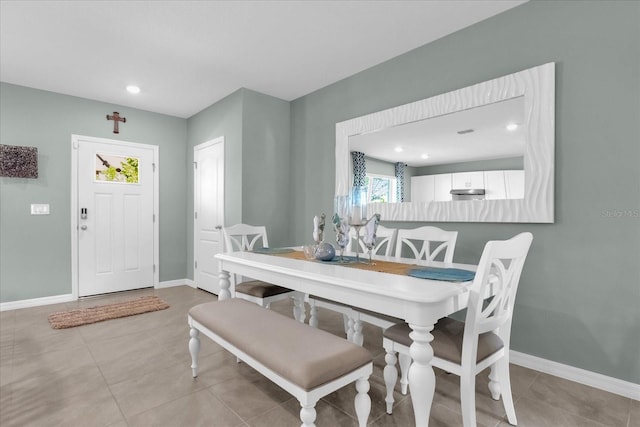 1555 Dawnview Way, Kissimmee, FL 34744 - dining area with healthy amount of natural light, baseboards, tile patterned flooring, and recessed lighting