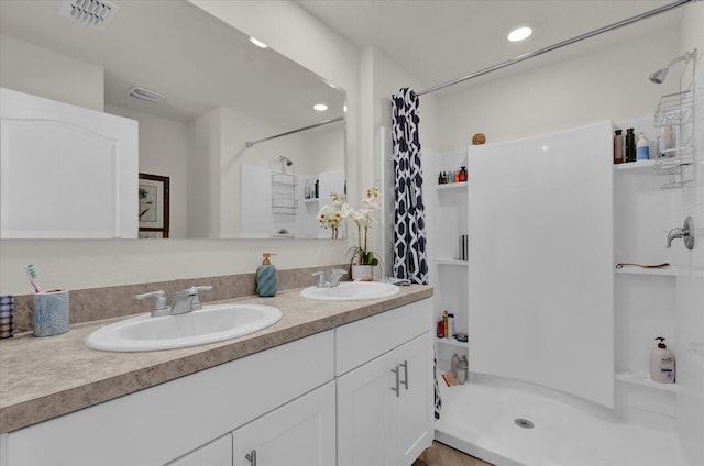 1555 Dawnview Way, Kissimmee, FL 34744 - bathroom with a stall shower and double vanity