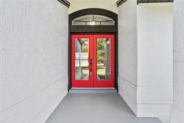 1438 Mclin Dr, Plant City, FL 33565 - view of exterior entry with french doors and stucco siding