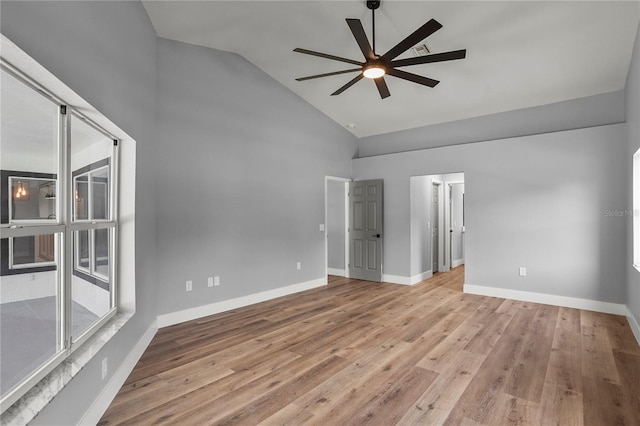 1438 Mclin Dr, Plant City, FL 33565 - spare room featuring a ceiling fan, high vaulted ceiling, wood finished floors, and baseboards