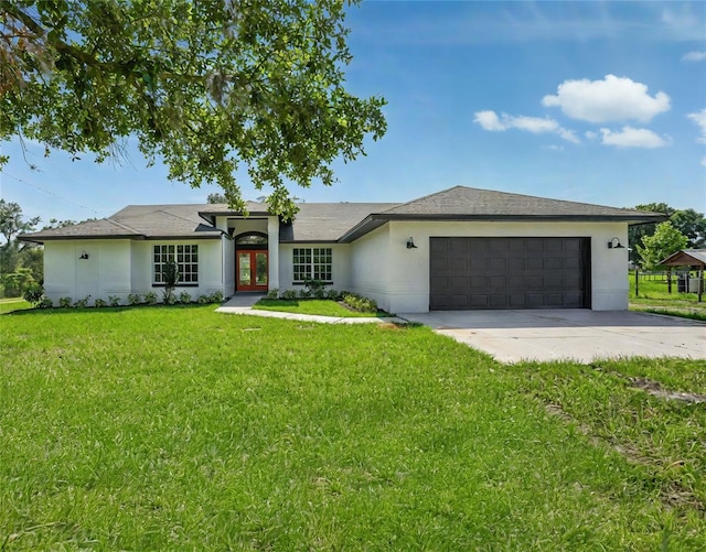 1438 Mclin Dr, Plant City, FL 33565 - single story home with an attached garage, french doors, driveway, stucco siding, and a front yard