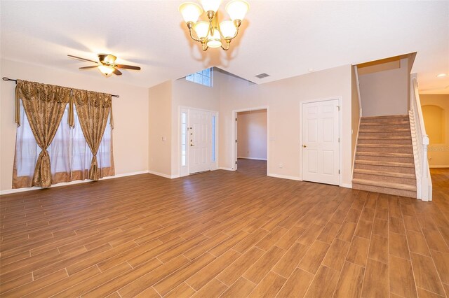 7263 Winding Lake Cir, Oviedo, FL 32765 - unfurnished living room with stairs, a chandelier, ceiling fan, and baseboards