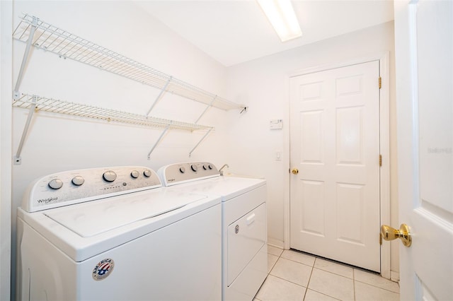 7263 Winding Lake Cir, Oviedo, FL 32765 - washroom featuring separate washer and dryer and light tile patterned floors
