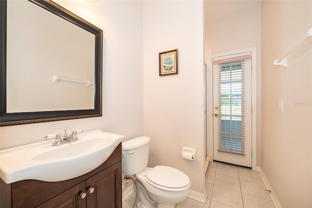 7263 Winding Lake Cir, Oviedo, FL 32765 - bathroom featuring toilet, baseboards, tile patterned floors, and vanity