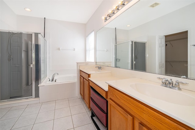 7263 Winding Lake Cir, Oviedo, FL 32765 - bathroom featuring a shower stall, a bath, tile patterned floors, and vanity
