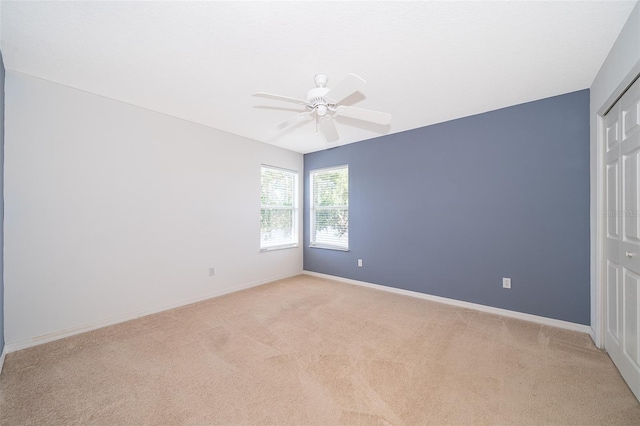 7263 Winding Lake Cir, Oviedo, FL 32765 - empty room featuring light colored carpet, ceiling fan, and baseboards