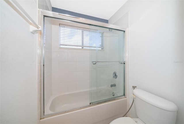 7263 Winding Lake Cir, Oviedo, FL 32765 - bathroom with toilet and bath / shower combo with glass door