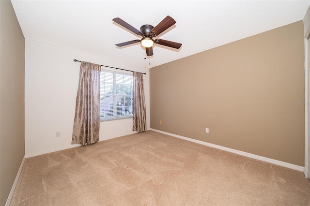 7263 Winding Lake Cir, Oviedo, FL 32765 - empty room featuring light carpet, ceiling fan, and baseboards