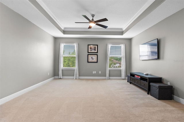 3865 W Stillwood Ln, Lake Mary, FL 32746 - spare room featuring a tray ceiling, ceiling fan, healthy amount of natural light, light carpet, and ornamental molding
