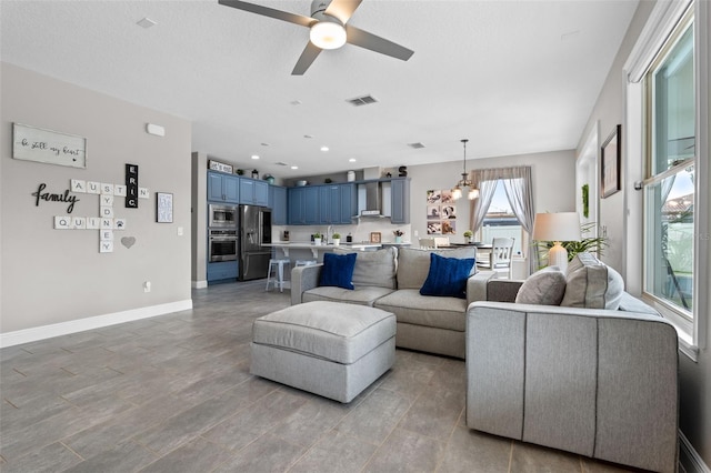 3865 W Stillwood Ln, Lake Mary, FL 32746 - living area with a ceiling fan, baseboards, and recessed lighting