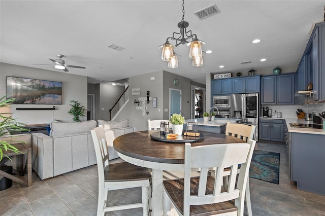3865 W Stillwood Ln, Lake Mary, FL 32746 - dining space featuring stairway, ceiling fan, recessed lighting, and a chandelier