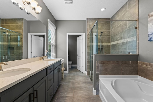 3865 W Stillwood Ln, Lake Mary, FL 32746 - bathroom with a garden tub, toilet, double vanity, a shower stall, and baseboards