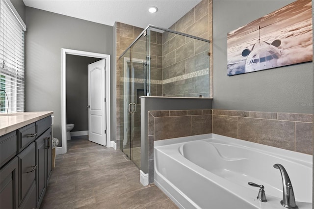 3865 W Stillwood Ln, Lake Mary, FL 32746 - full bath with a bath, toilet, a shower stall, vanity, and recessed lighting