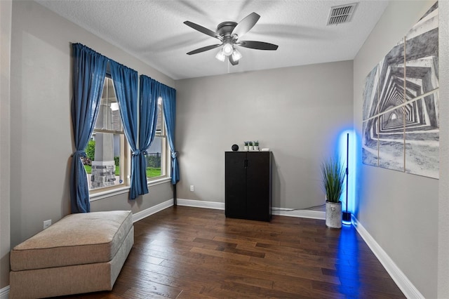 3865 W Stillwood Ln, Lake Mary, FL 32746 - living area with hardwood / wood-style flooring, ceiling fan, a textured ceiling, and baseboards