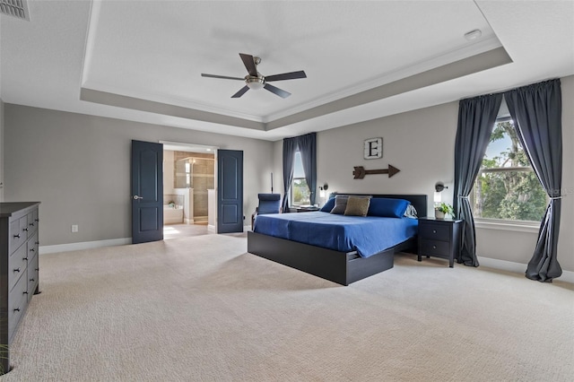 3865 W Stillwood Ln, Lake Mary, FL 32746 - bedroom with a raised ceiling, baseboards, light carpet, ensuite bath, and crown molding