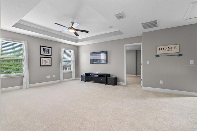 3865 W Stillwood Ln, Lake Mary, FL 32746 - sitting room featuring a tray ceiling, a ceiling fan, light carpet, and healthy amount of natural light