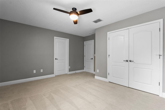 3865 W Stillwood Ln, Lake Mary, FL 32746 - unfurnished bedroom featuring light carpet, baseboards, ceiling fan, and a closet