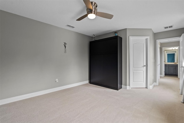 3865 W Stillwood Ln, Lake Mary, FL 32746 - unfurnished bedroom with light carpet, baseboards, and a ceiling fan