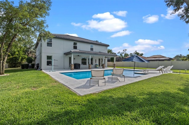 3865 W Stillwood Ln, Lake Mary, FL 32746 - back of property with ceiling fan, a tile roof, a patio, and stucco siding
