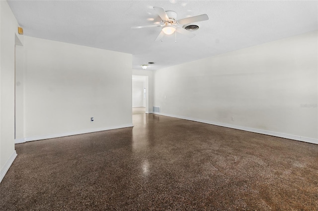 1340 Continental Dr, Daytona Beach, FL 32117 - empty room with speckle patterned floor, ceiling fan, and baseboards