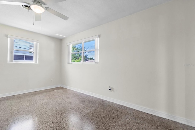 1340 Continental Dr, Daytona Beach, FL 32117 - spare room with speckle patterned floor, baseboards, and a ceiling fan