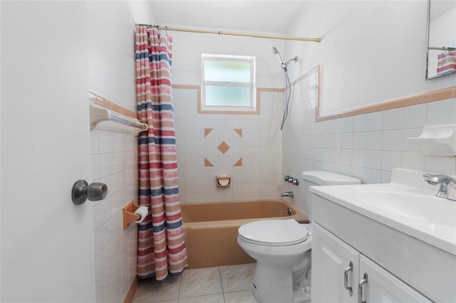 1340 Continental Dr, Daytona Beach, FL 32117 - bathroom with tile walls, shower / bathtub combination with curtain, toilet, tile patterned floors, and vanity