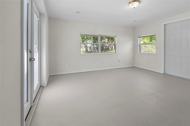 1340 Continental Dr, Daytona Beach, FL 32117 - unfurnished bedroom featuring finished concrete flooring and baseboards