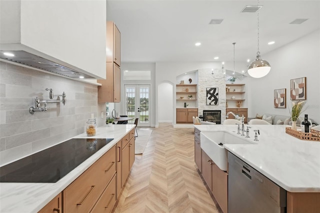1266 Saint Albans Loop, Lake Mary, FL 32746 - kitchen with dishwasher, a sink, open floor plan, a large fireplace, and black electric cooktop