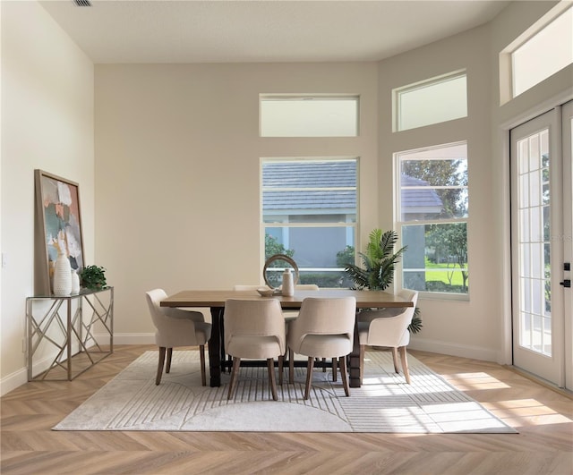 1266 Saint Albans Loop, Lake Mary, FL 32746 - dining space with a high ceiling and baseboards