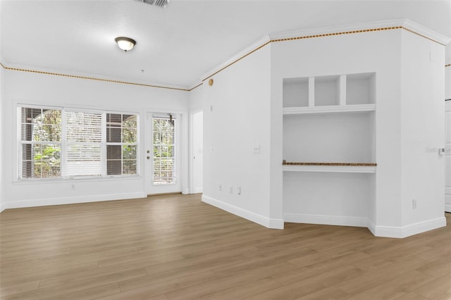 3561 Conroy Rd Unit 216, Orlando, FL 32839 - unfurnished room featuring wood finished floors, ornamental molding, and baseboards
