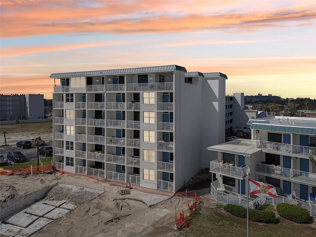 935 S Atlantic Ave Unit 302, Daytona Beach, FL 32118 - property at dusk featuring a view of apartment building / complex