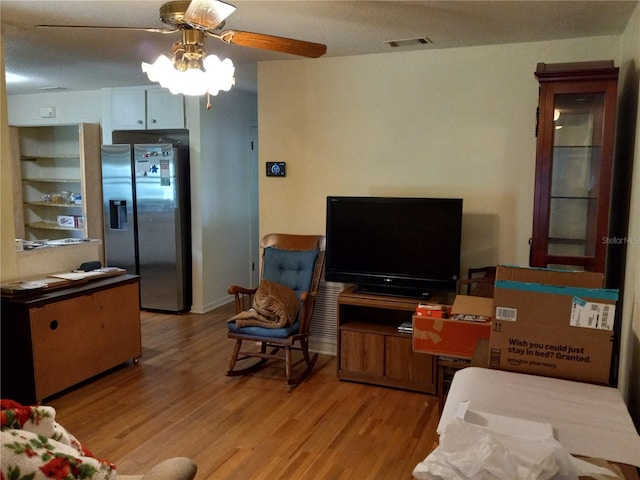 1322 Royal Birkdale Cir, Rockledge, FL 32955 - living area with light wood-type flooring and a ceiling fan