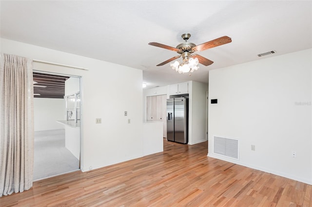 1322 Royal Birkdale Cir, Rockledge, FL 32955 - empty room featuring a ceiling fan and light wood-type flooring