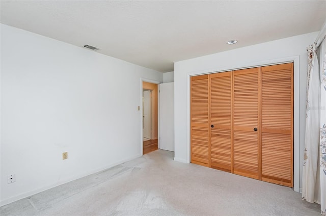 1322 Royal Birkdale Cir, Rockledge, FL 32955 - unfurnished bedroom featuring light colored carpet and a closet
