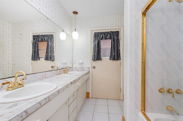 1322 Royal Birkdale Cir, Rockledge, FL 32955 - full bathroom featuring wallpapered walls, double vanity, tile patterned flooring, and tub / shower combination