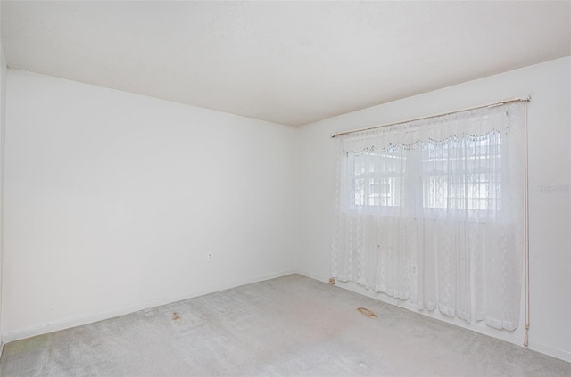 1322 Royal Birkdale Cir, Rockledge, FL 32955 - spare room featuring carpet and baseboards
