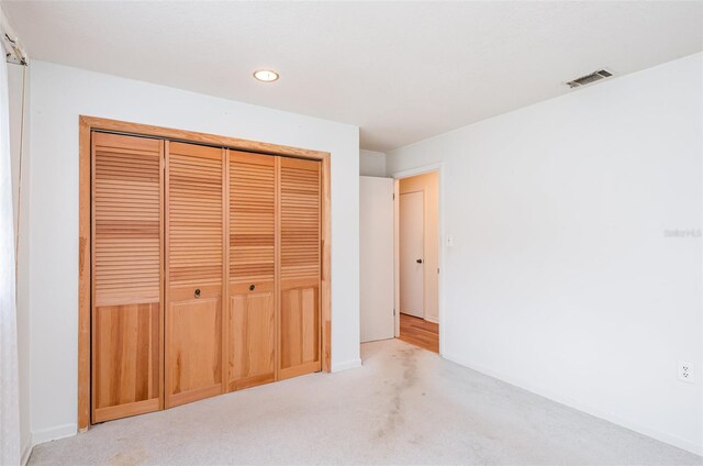 1322 Royal Birkdale Cir, Rockledge, FL 32955 - unfurnished bedroom featuring carpet floors, a closet, recessed lighting, and baseboards