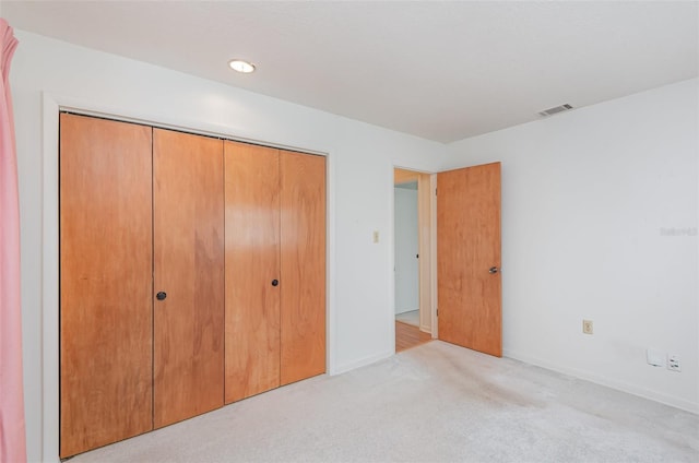 1322 Royal Birkdale Cir, Rockledge, FL 32955 - unfurnished bedroom with carpet floors, a closet, and baseboards