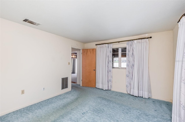 1322 Royal Birkdale Cir, Rockledge, FL 32955 - carpeted empty room with baseboards