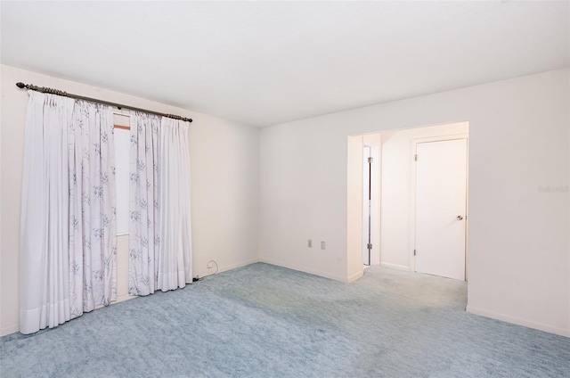 1322 Royal Birkdale Cir, Rockledge, FL 32955 - spare room featuring carpet and baseboards