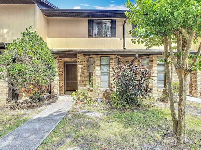 1806 Foxhall Cir Unit 1806, Kissimmee, FL 34741 - multi unit property featuring brick siding and a porch