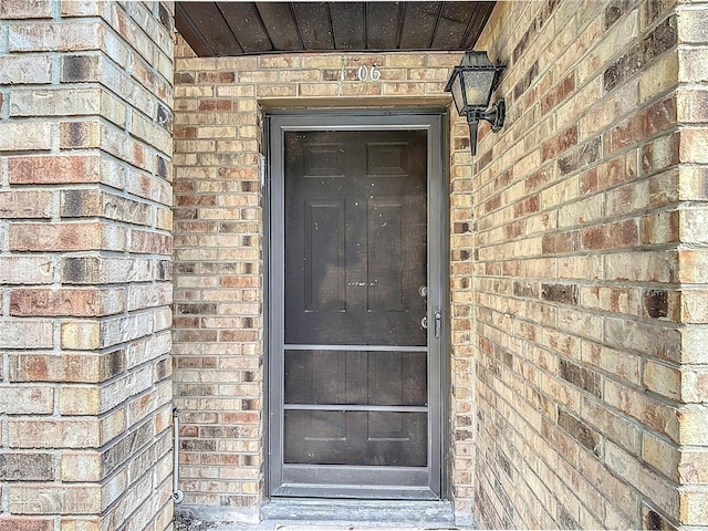 1806 Foxhall Cir Unit 1806, Kissimmee, FL 34741 - view of exterior entry featuring brick siding